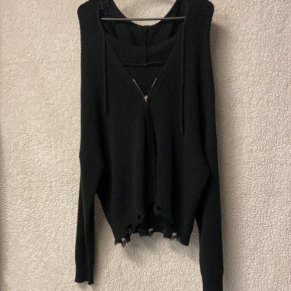 Black zipped sweater.